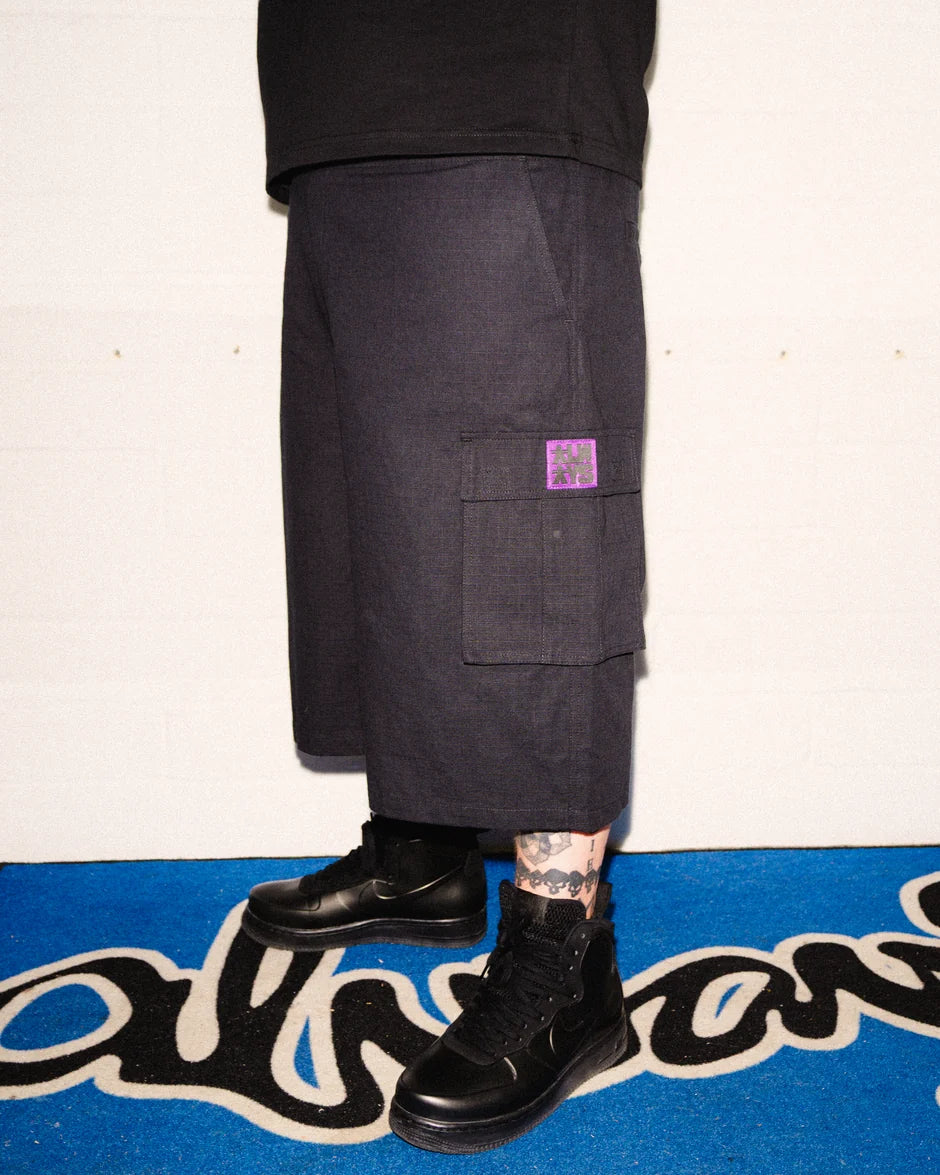 Always Do What You Should Do Rip Stop Cargo Shorts in Black, side view worn by a model, showing the cargo pocket