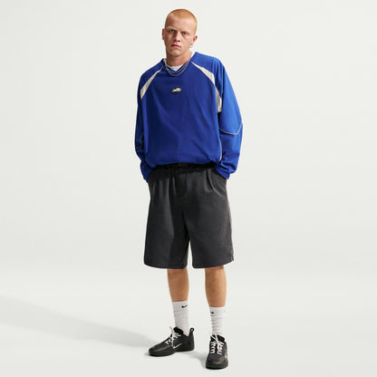 Nike SB Bagel Skate Shorts in Black / White, modelled front outfit view showing the wide, knee-length cut.