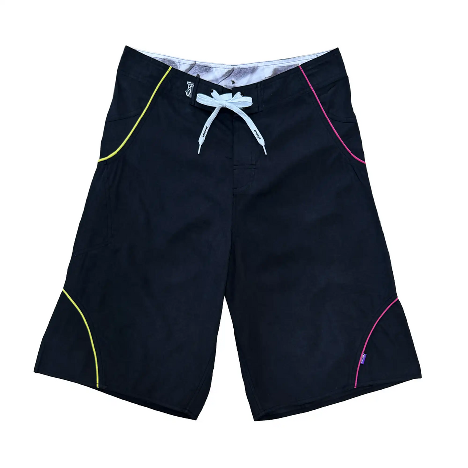 Always Do What You Should Do A.I Wrapped Boardshorts in Black / Yellow / Fuchsia, front view with yellow and pink curved piping and white waist ties.