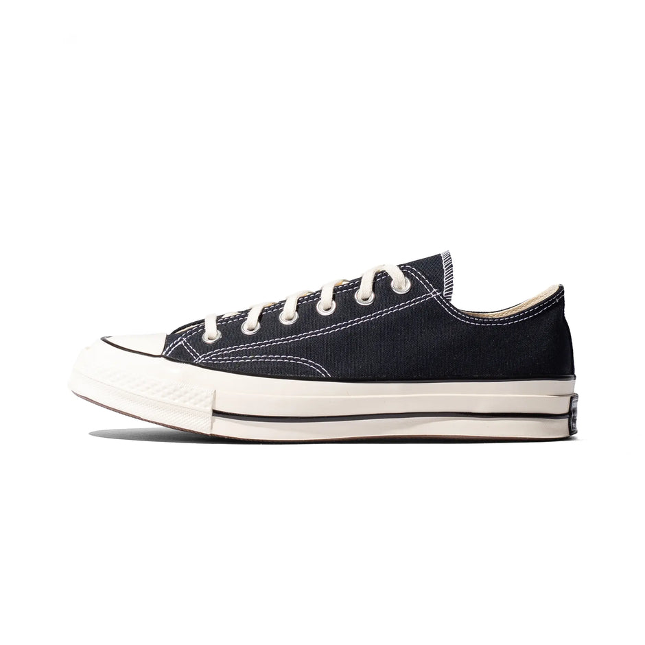 Converse Chuck Taylor 70 Low in Black / Black / Egret, side view with cream toe cap and white stitching.