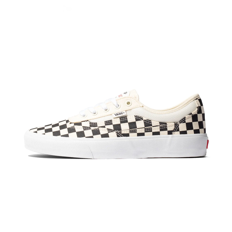 Vans Skate Curren Caples shoes in Checkerboard Black / White, side view showing the checkerboard upper and white sole.